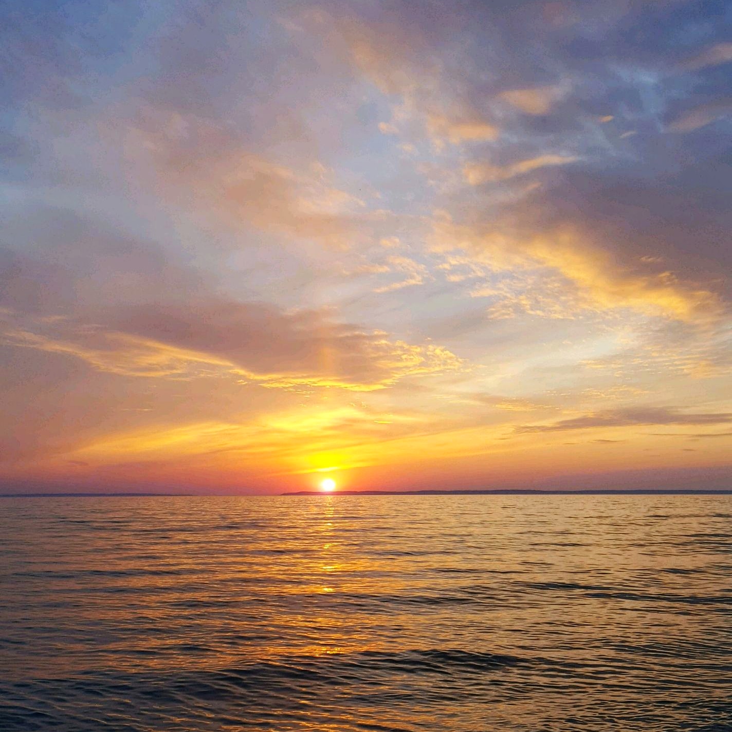 Amazing and beautiful sunset over Lake Michigan at Van's Beach in Leelanau County, Michigan.
