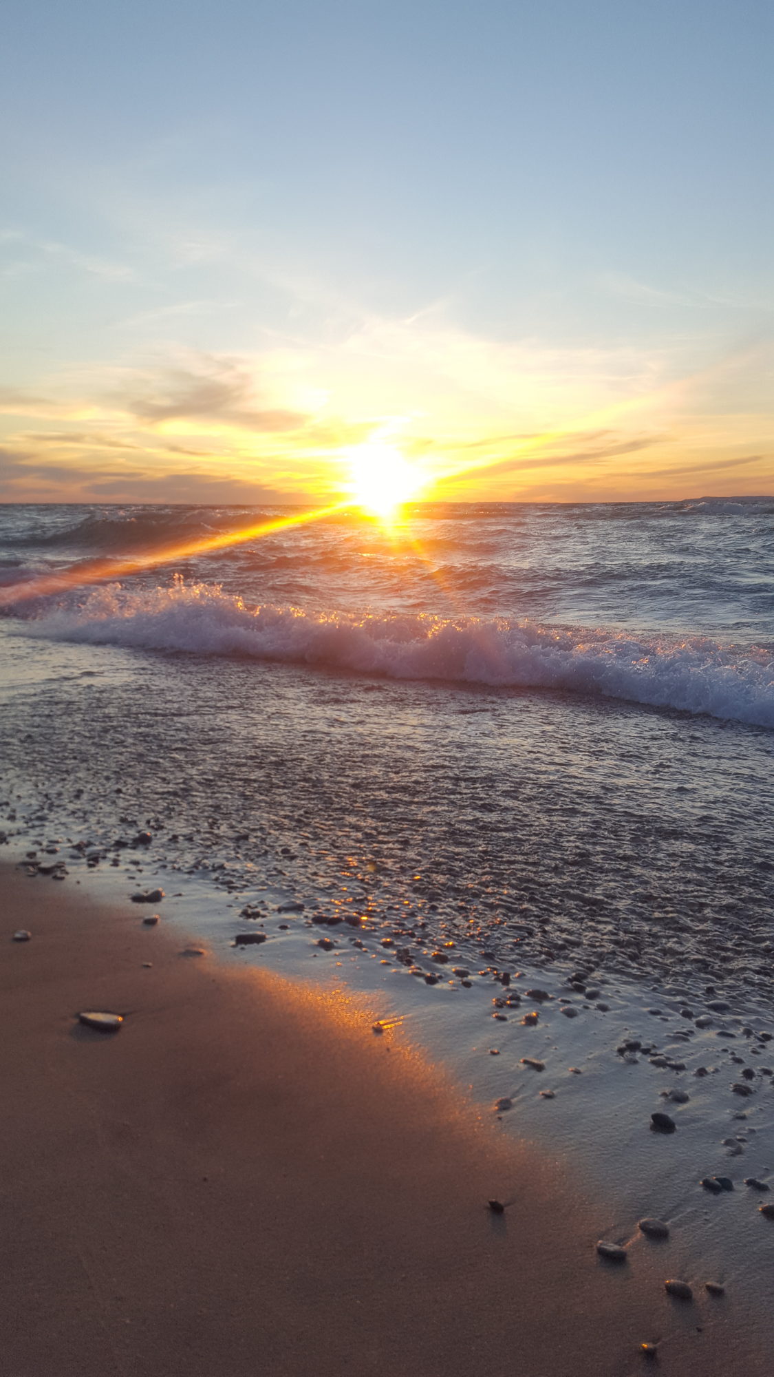 A Beautiful sunset on Lake Michigan at Van's Beach in Leelanau County, Michigan.